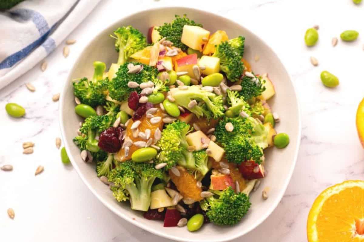 Fresh broccoli, apples, and oranges tossed together with orange juice dressing for light and refreshing summer salad.