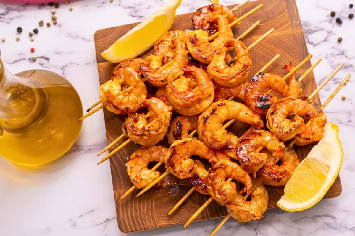 Honey Garlic Grilled Shrimp Skewers on wooden platter.