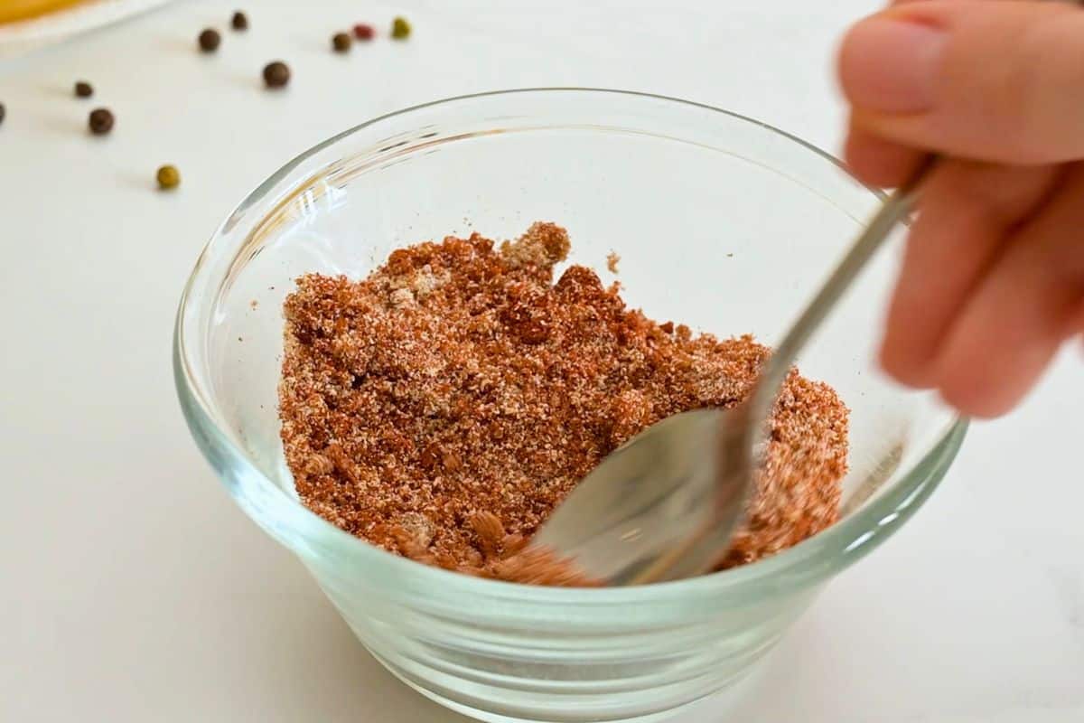 Crockpot Pulled Chicken Brown sugar, salt, and dry spices being mixed in small bowl for dry rub for pulled chicken.