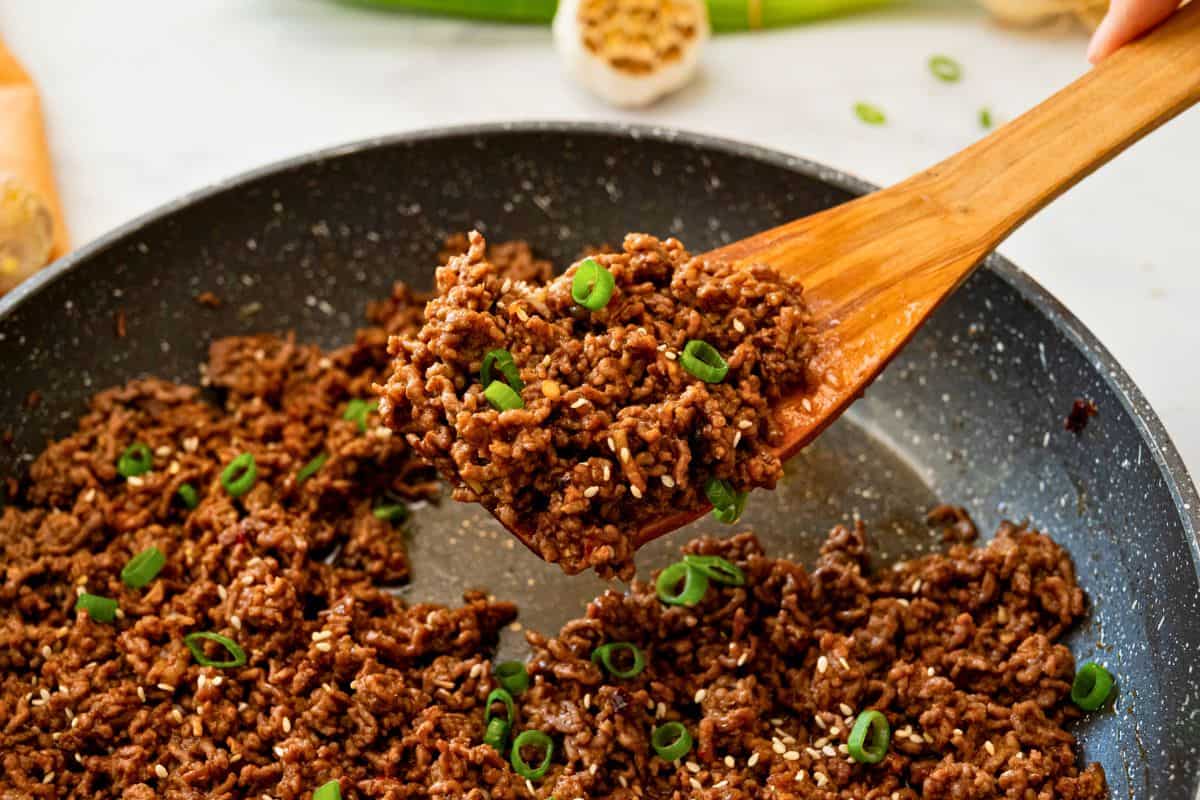 Easy 20-Minute Dinner with Ground Beef Spoonful of browned ground beef with thickened Korean sauce coating beef.