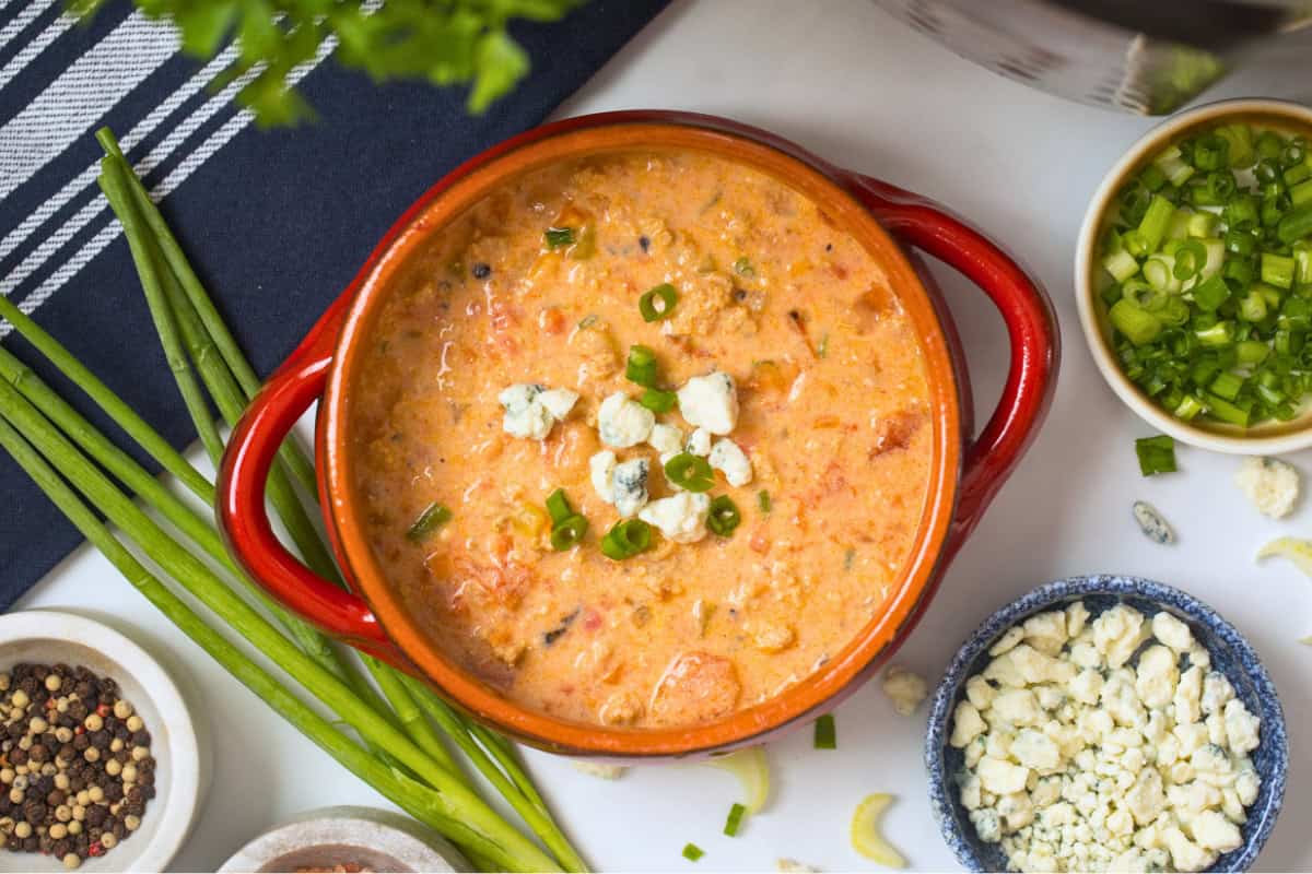 Buffalo Chicken Chili made with Ground Chicken in Instant Pot Bowl of creamy Instant Pot Buffalo Chicken Chili made with cream cheese and topped the blue cheese.