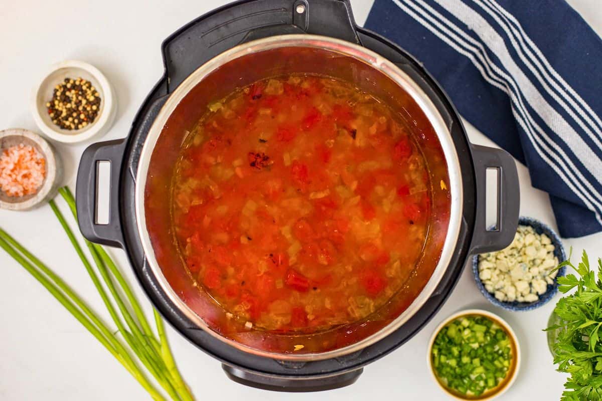 Pressure Cooker Buffalo Chicken Chili Pressure cooked chicken chili with fire roasted tomatoes, white beans, and hot sauce.