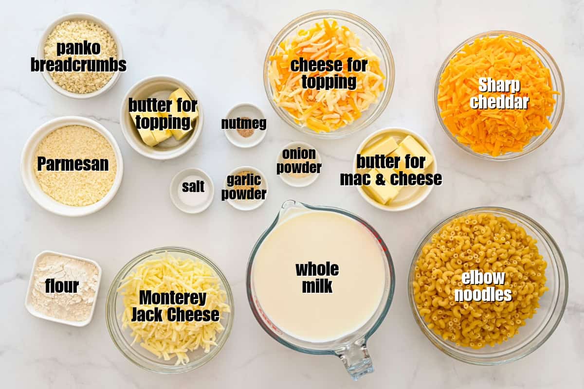 Ingredients for Baked Mac and Cheese Elbow noodles, milk, cheddar, Monterey Jack, Parmesan, Panko, butter, and spices for baked mac and cheese.