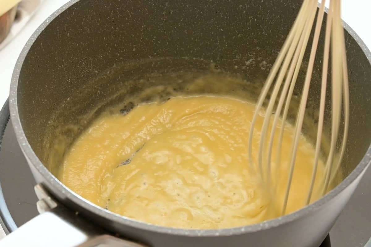 Mac and Cheese with Homemade Sauce Whisk combining flour and butter together in small saucepan to form a thick paste.
