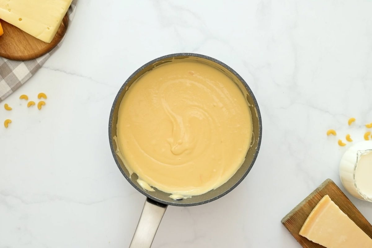 Mac and Cheese with From-Scratch Cheese Sauce Saucepan with from-scratch cheese sauce.