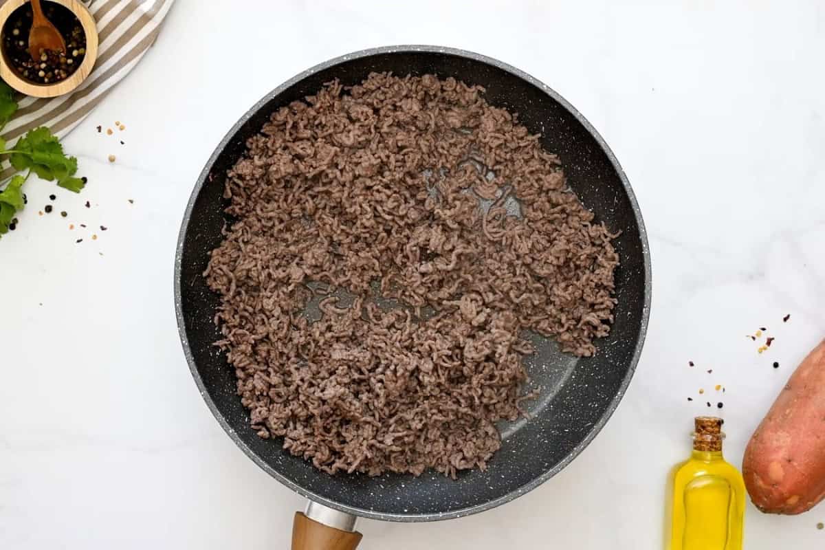 Taco Bowl with Ground Beef Ground beef cooked and crumbled in saute pan.