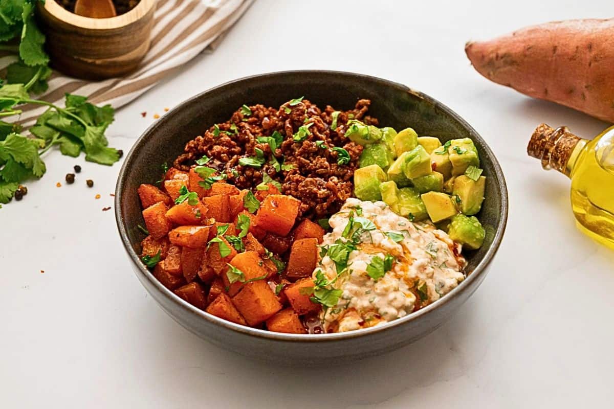 Ground Beef with Sweet Potatoes and Cottage Cheese Ground Beef seasoned with taco seasoning served with roasted sweet potatoes, cottage cheese, and hot honey.