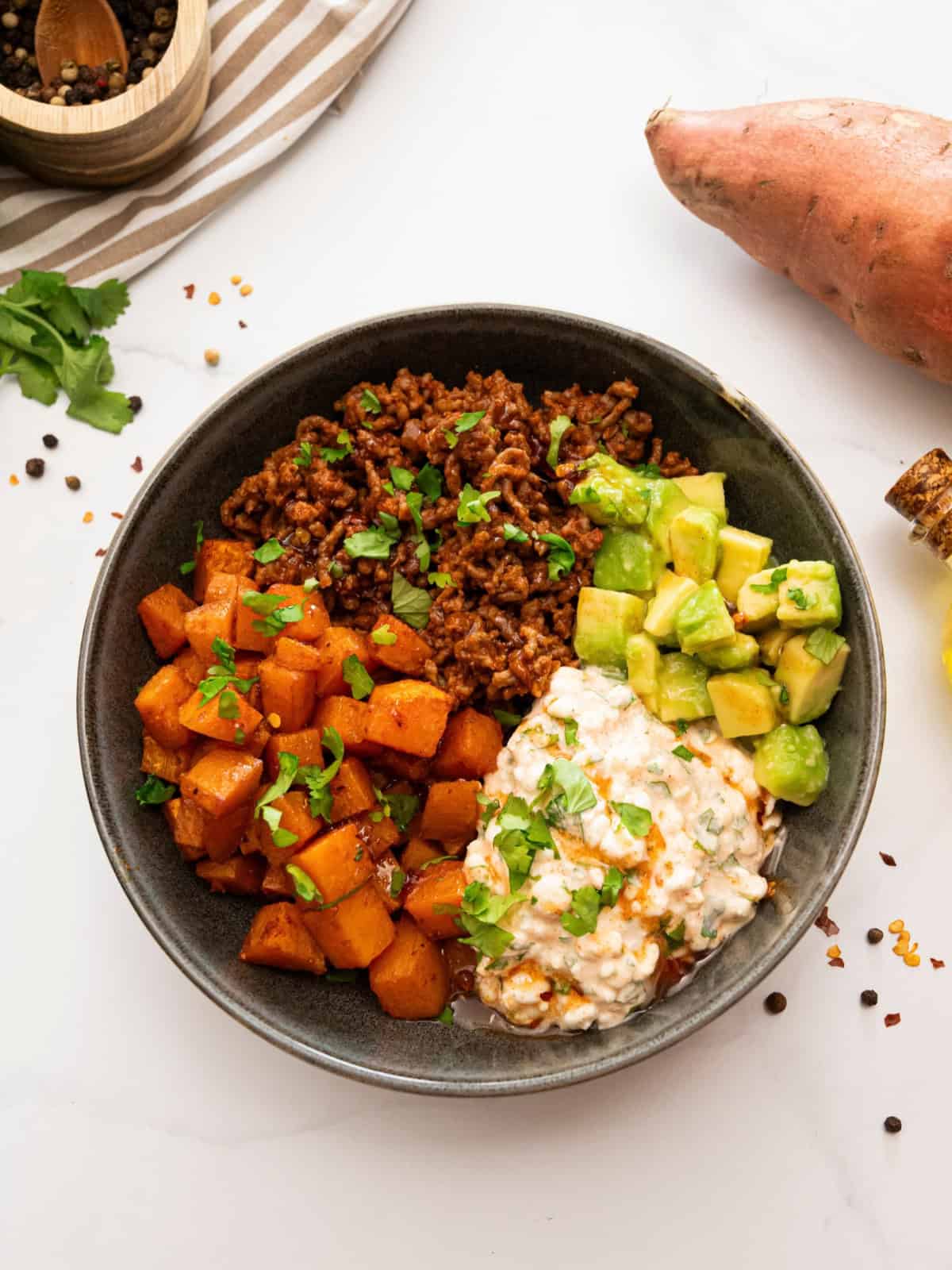 Seasoned taco meat served with roasted sweet potatoes, cottage cheese, and hot honey.